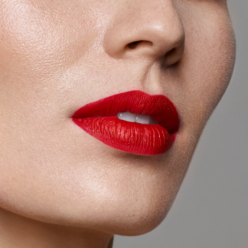 LILIPANI Lippy in a Bottle vegan matte liquid lipstick in Rose, a bright red, on lips